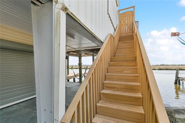 stairway featuring a water view