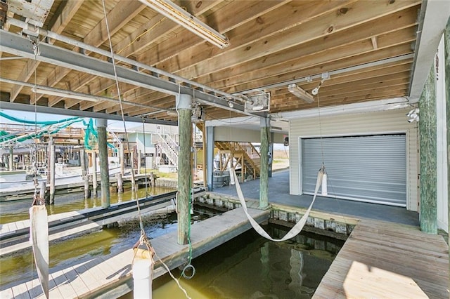 view of dock with a water view and boat lift