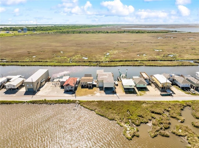 drone / aerial view with a water view and a residential view