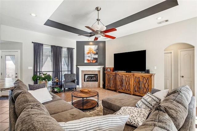 40339 Chandler Dr, Ponchatoula, LA 70454 - tiled living room featuring recessed lighting, a ceiling fan, visible vents, arched walkways, and a tile fireplace