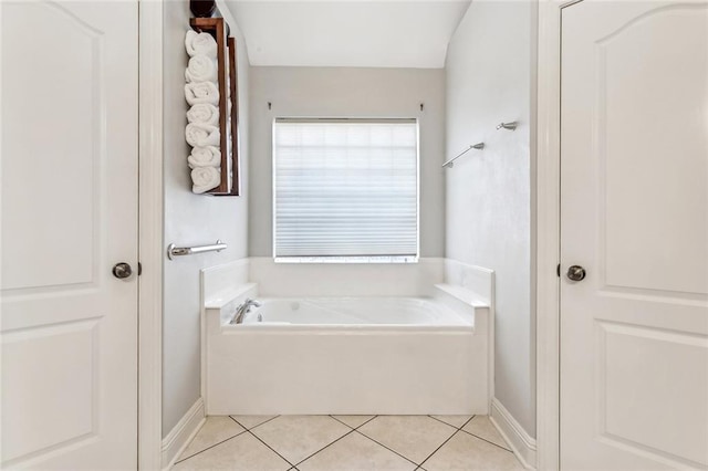 40339 Chandler Dr, Ponchatoula, LA 70454 - bathroom featuring a bath, baseboards, and tile patterned floors