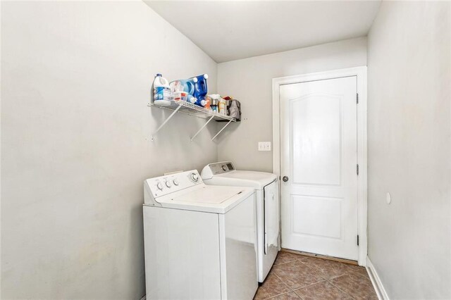 40339 Chandler Dr, Ponchatoula, LA 70454 - laundry room featuring light tile patterned floors, separate washer and dryer, laundry area, and baseboards