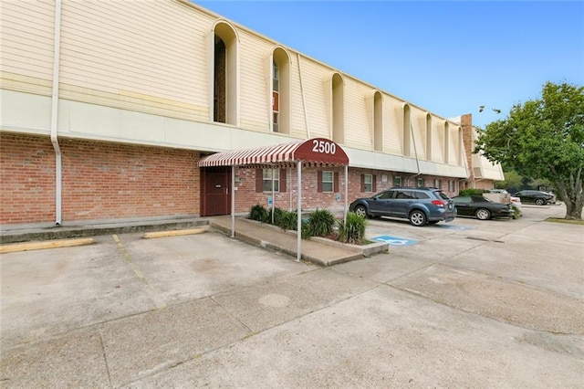 view of property with uncovered parking