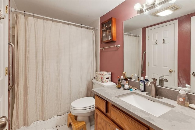bathroom with vanity, tile patterned flooring, toilet, and visible vents