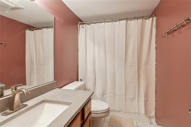 bathroom featuring toilet, a shower with curtain, visible vents, and vanity