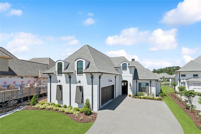 466 Cercle Du Lac, Covington, LA 70433 - french country home with a residential view, a chimney, driveway, an attached garage, and a front yard