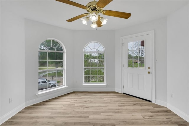 7721 Bullard Ave, New Orleans, LA 70128 - entryway featuring baseboards, light wood finished floors, and ceiling fan