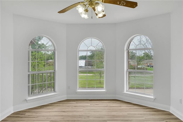 7721 Bullard Ave, New Orleans, LA 70128 - unfurnished room with baseboards, a ceiling fan, and wood finished floors