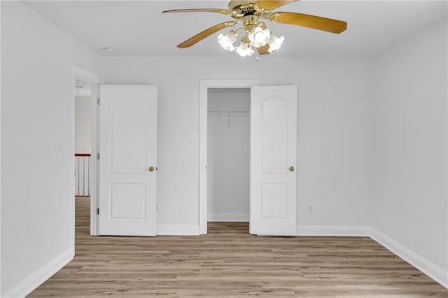 7721 Bullard Ave, New Orleans, LA 70128 - unfurnished bedroom featuring light wood-style floors, a closet, ceiling fan, and baseboards