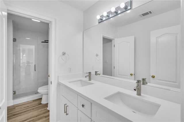 7721 Bullard Ave, New Orleans, LA 70128 - bathroom featuring a sink, visible vents, toilet, and a marble finish shower