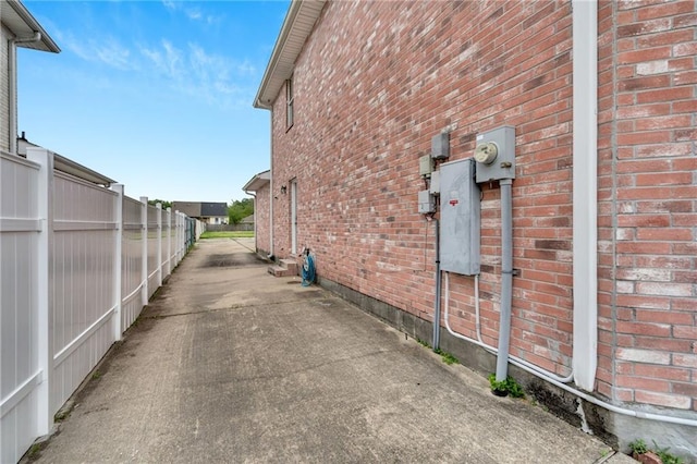 7721 Bullard Ave, New Orleans, LA 70128 - view of property exterior with fence and brick siding