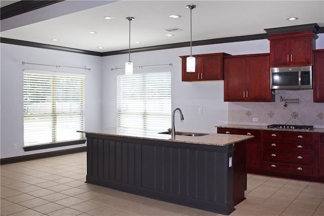 23620 Madisonville Ct, Ponchatoula, LA 70454 - kitchen featuring light stone counters, a sink, visible vents, stainless steel appliances, and dark brown cabinets