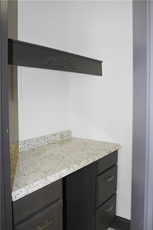 23620 Madisonville Ct, Ponchatoula, LA 70454 - interior space featuring light countertops and dark cabinetry