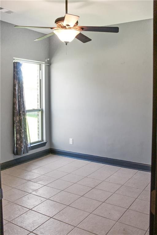 23620 Madisonville Ct, Ponchatoula, LA 70454 - unfurnished room featuring light tile patterned flooring, ceiling fan, and baseboards