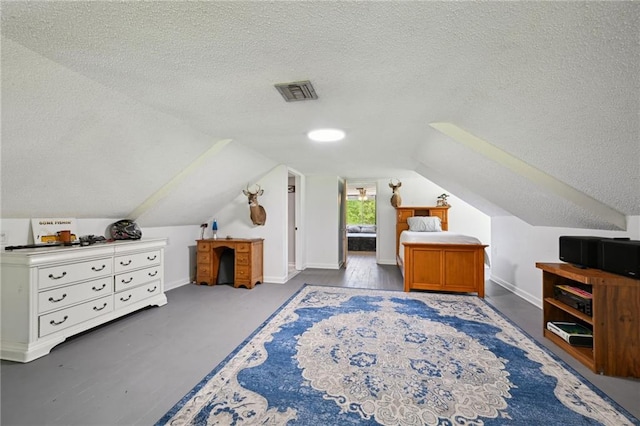 74307 Jack Lloyd Rd, Abita Springs, LA 70420 - bedroom with a textured ceiling, baseboards, vaulted ceiling, and visible vents