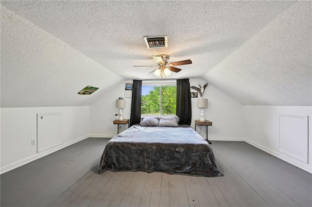 74307 Jack Lloyd Rd, Abita Springs, LA 70420 - bedroom featuring a textured ceiling, baseboards, lofted ceiling, and visible vents