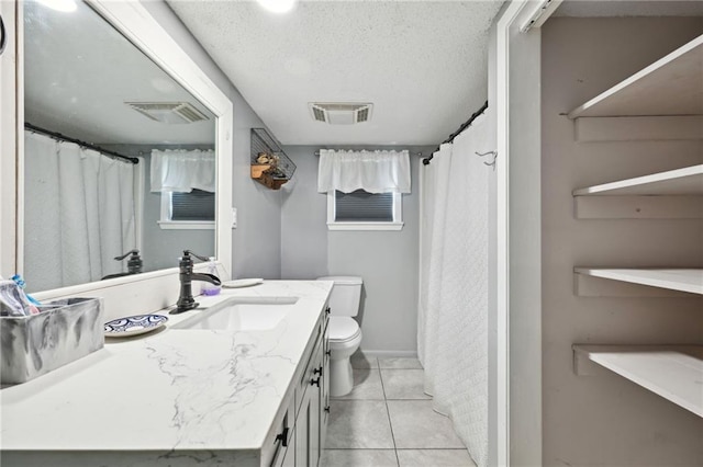 74307 Jack Lloyd Rd, Abita Springs, LA 70420 - full bath with tile patterned floors, vanity, visible vents, and toilet