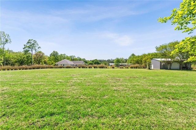 74307 Jack Lloyd Rd, Abita Springs, LA 70420 - view of yard with a rural view, an outbuilding, and a pole building