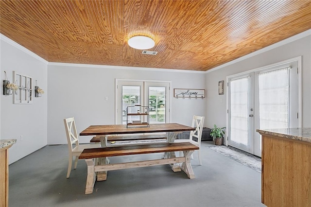 dining room featuring visible vents, finished concrete flooring, wooden ceiling, and french doors