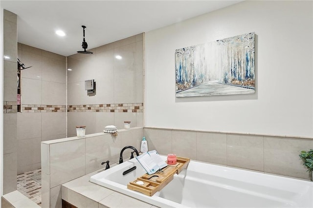 bathroom with a garden tub, walk in shower, and recessed lighting