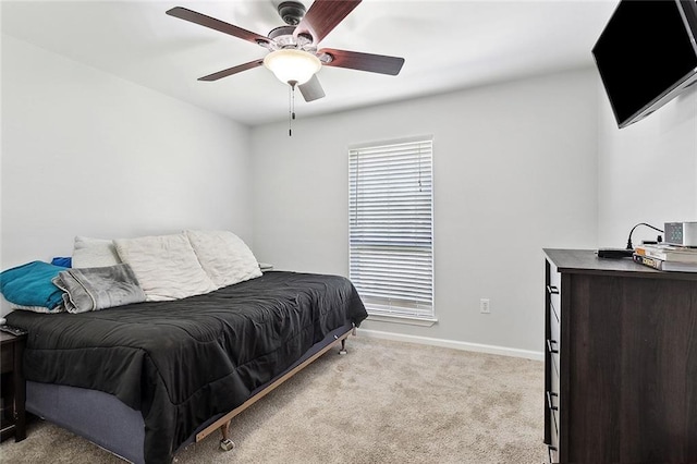 bedroom featuring ceiling fan, baseboards, and carpet flooring