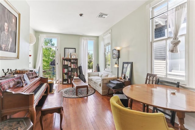 sitting room featuring visible vents and hardwood / wood-style flooring