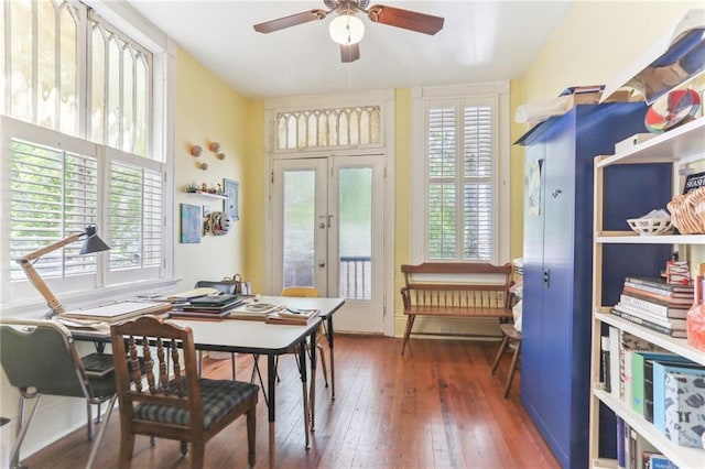 office space featuring french doors, wood-type flooring, a wealth of natural light, and a ceiling fan