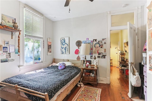 bedroom with ceiling fan and wood finished floors
