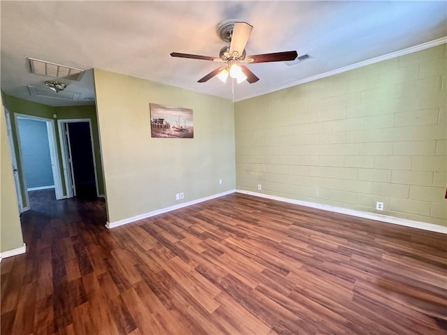 3420 Willow St, New Orleans, LA 70115 - spare room featuring attic access, a ceiling fan, concrete block wall, wood finished floors, and ornamental molding