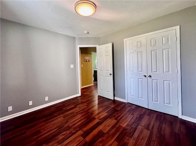 3420 Willow St, New Orleans, LA 70115 - unfurnished bedroom featuring dark wood-style floors and a closet