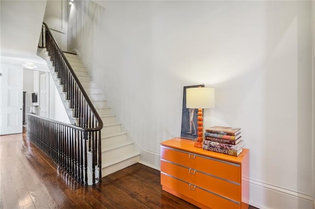 stairs with wood-type flooring