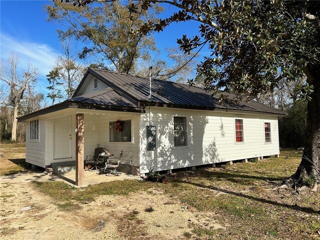 25821 Elsie Gill Rd, Holden, LA 70744 - exterior space featuring a patio and metal roof