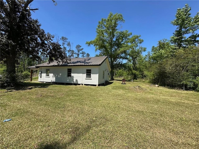 25821 Elsie Gill Rd, Holden, LA 70744 - exterior space with a yard and metal roof