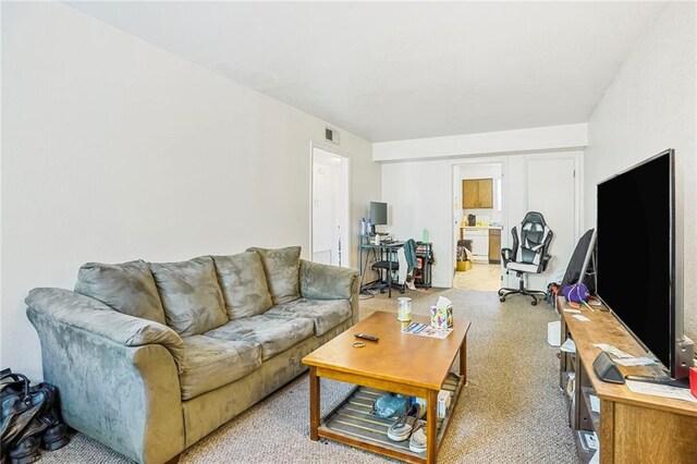 4018 Pitt St, New Orleans, LA 70115 - living room featuring visible vents and light colored carpet