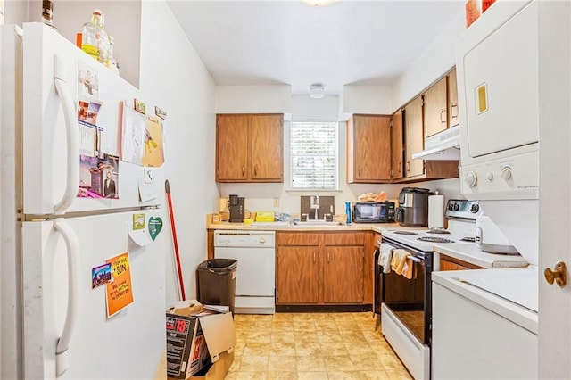 4018 Pitt St, New Orleans, LA 70115 - kitchen featuring white appliances, light countertops, under cabinet range hood, brown cabinets, and a sink