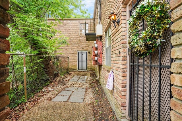 4018 Pitt St, New Orleans, LA 70115 - view of property exterior featuring brick siding and fence