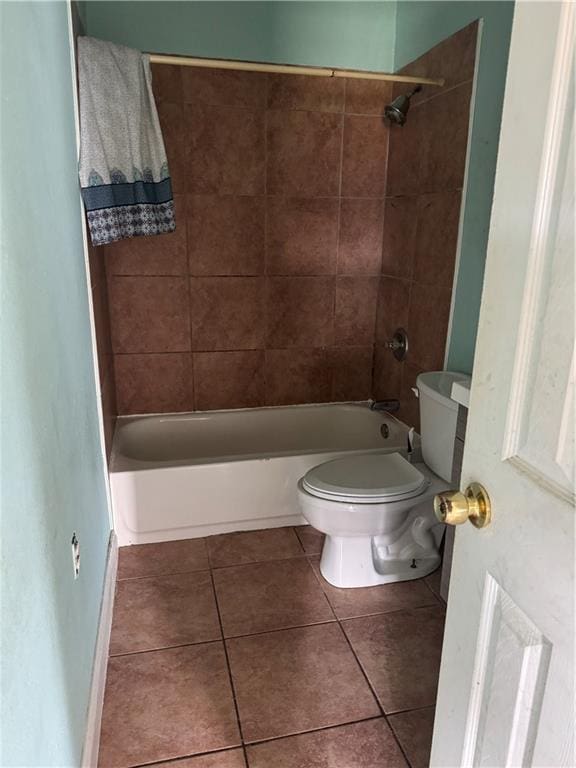 full bathroom with toilet, shower / tub combination, and tile patterned flooring