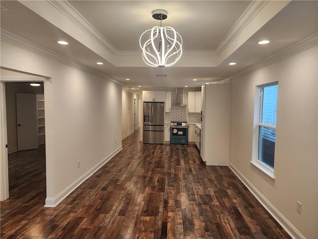 2417 Eagle St, New Orleans, LA 70118 - interior space with a tray ceiling, dark wood-type flooring, ornamental molding, a notable chandelier, and baseboards