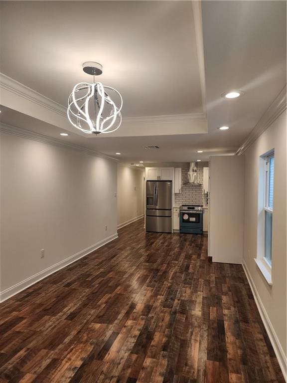 2417 Eagle St, New Orleans, LA 70118 - unfurnished living room with dark wood-type flooring, ornamental molding, recessed lighting, and a notable chandelier