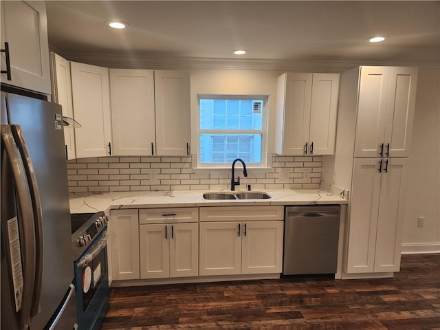 2417 Eagle St, New Orleans, LA 70118 - kitchen with tasteful backsplash, light stone counters, white cabinetry, appliances with stainless steel finishes, and a sink