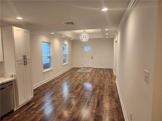 2417 Eagle St, New Orleans, LA 70118 - interior space with crown molding, visible vents, dark wood-style flooring, a raised ceiling, and baseboards