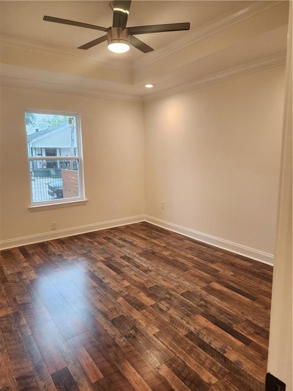 2417 Eagle St, New Orleans, LA 70118 - spare room with crown molding, a ceiling fan, a raised ceiling, baseboards, and dark wood-style floors