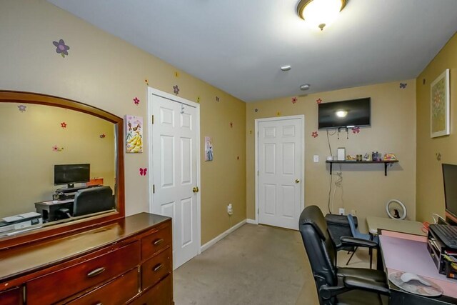 office with light colored carpet and baseboards