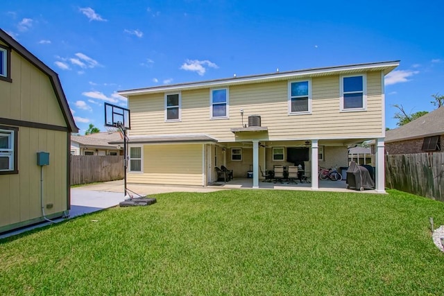 back of house with a lawn, a fenced backyard, central AC unit, and a patio