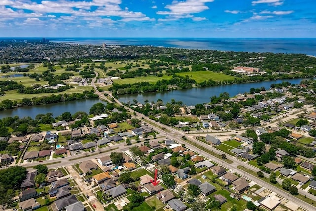drone / aerial view featuring a water view and a residential view