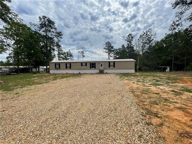 69476 S River Rd, Kentwood, LA 70444 - view of front facade with gravel driveway