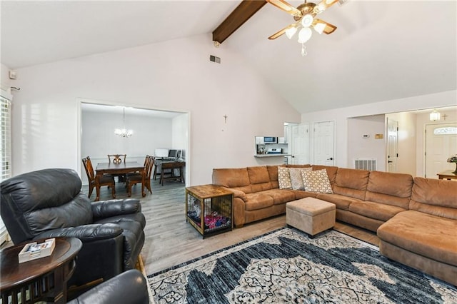 living room with visible vents, beamed ceiling, wood finished floors, and ceiling fan with notable chandelier
