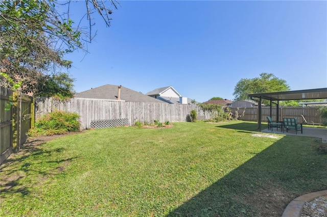 view of yard with a patio and a fenced backyard