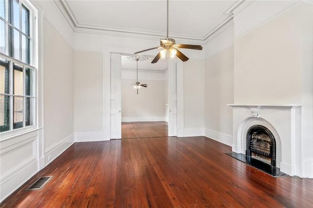 101012 Philip St, New Orleans, LA 70130 - unfurnished living room featuring a ceiling fan, hardwood / wood-style floors, crown molding, a fireplace, and baseboards