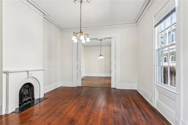 101012 Philip St, New Orleans, LA 70130 - unfurnished living room featuring a chandelier, ornamental molding, hardwood / wood-style flooring, baseboards, and a fireplace